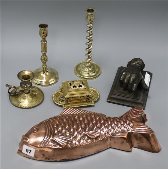 A copper fish shaped jelly mould, a hand desk weight, candlesticks etc tallest 22cm